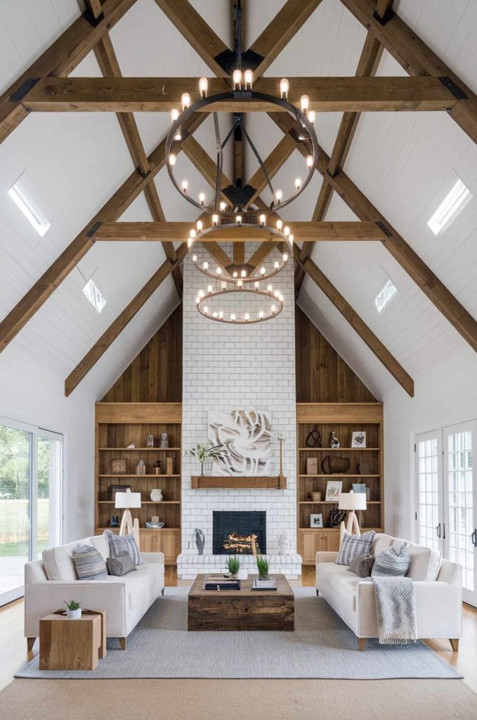 Chic barndominium living room with vaulted ceilings and exposed beams