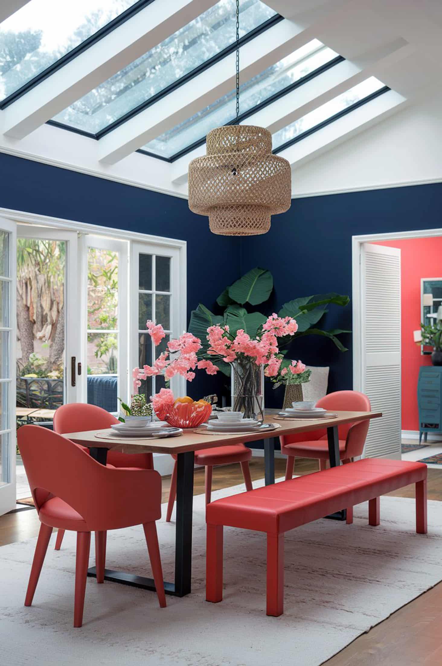 Chic pastel paradise navy & coral hues in a bright, airy room