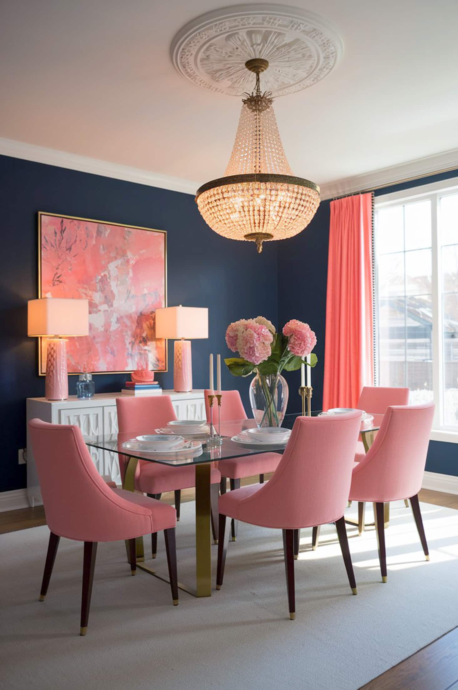 Elegant dining room with tiffany chandeliers, navy & coral accents
