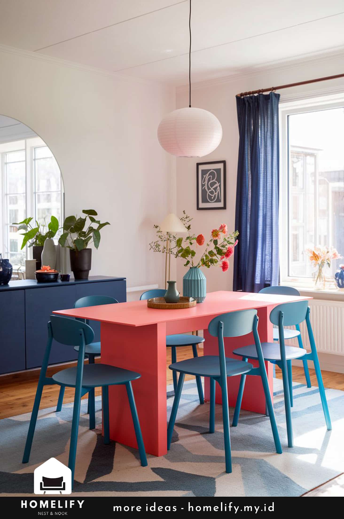 Playful nordic dining room with coral table & blue chairs