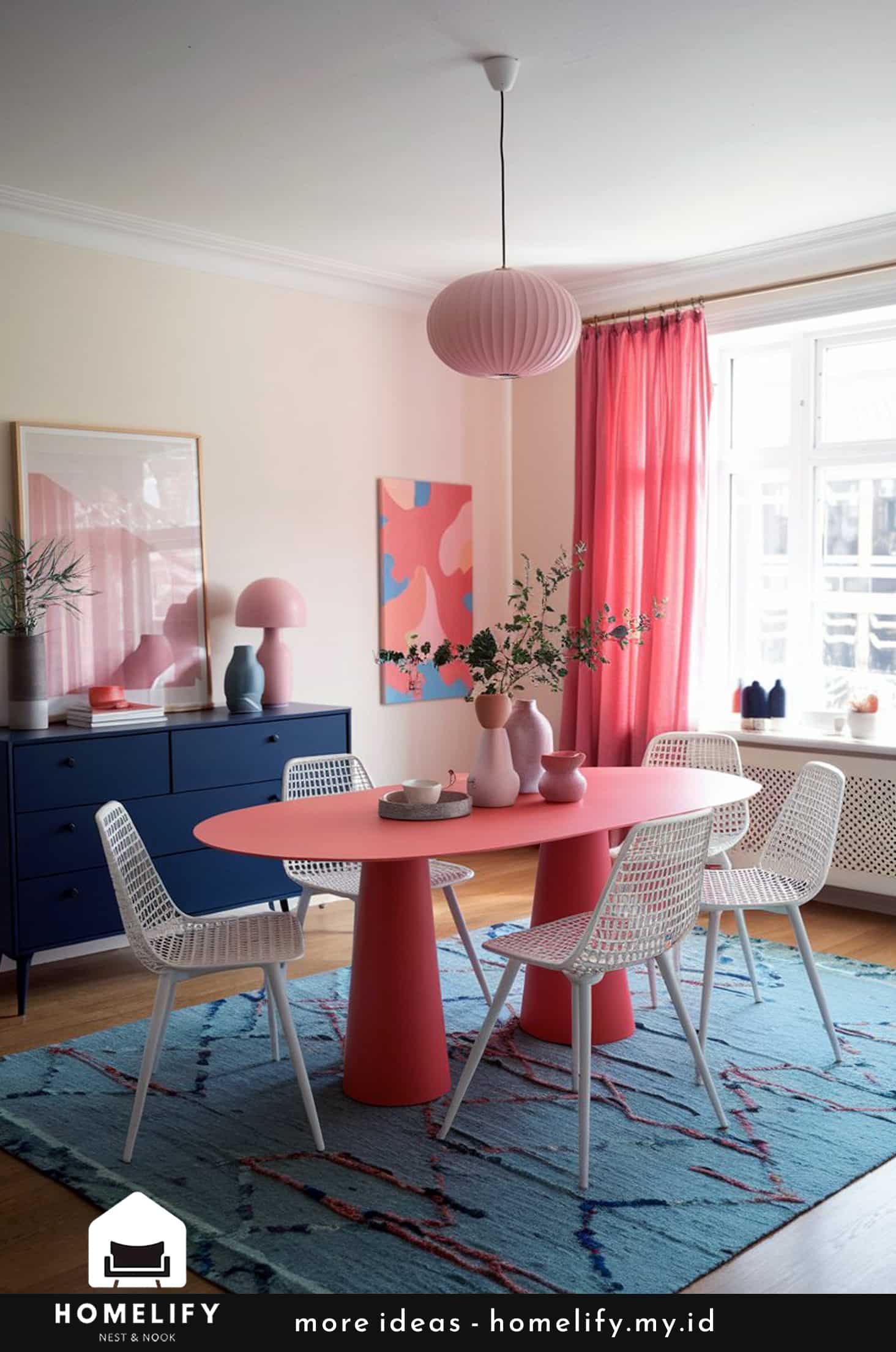 Vibrant dining room with coral table, blue rug & navy accents